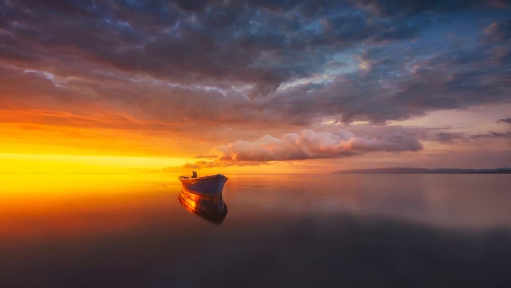 Serene Boat Sunset by joanaduenas — canvas wall art