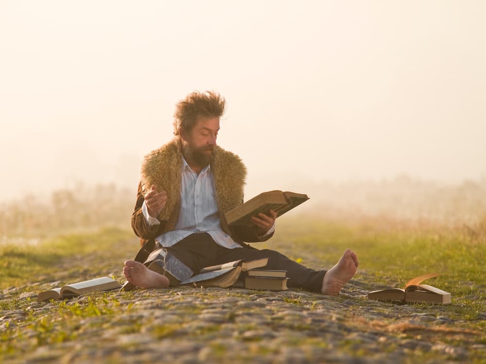 Rustic Man Reading Outdoors by Leszek Paradowski — canvas wall art