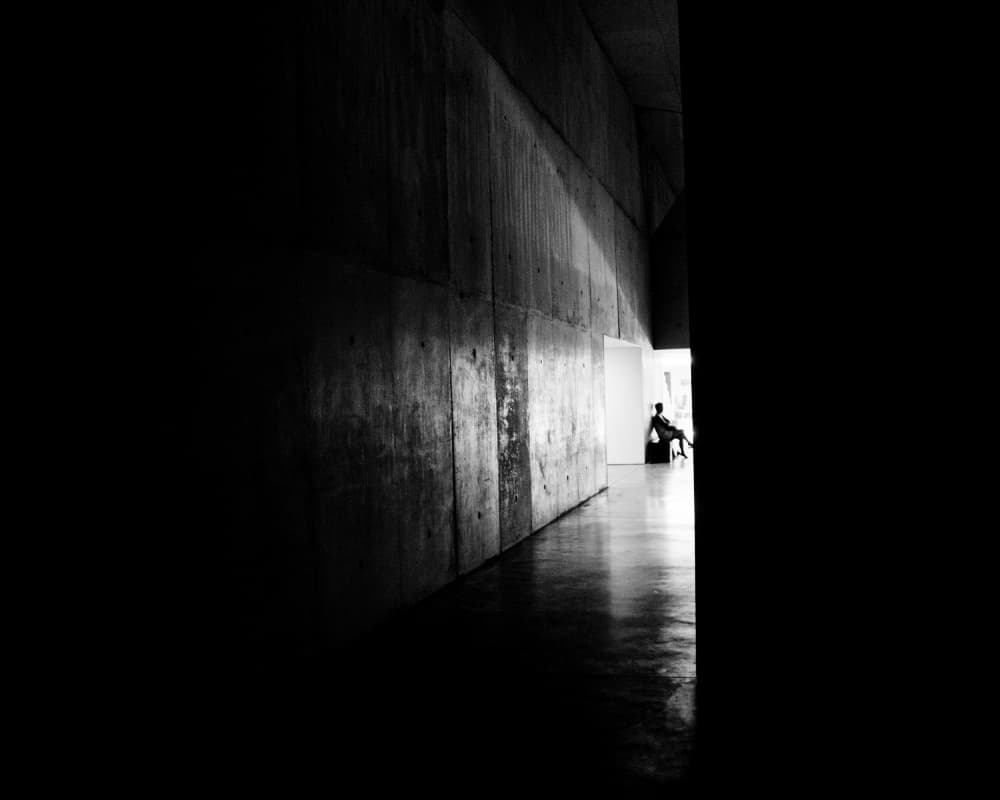 Lone Figure in Concrete Hall by Luis Borges Alves — canvas wall art