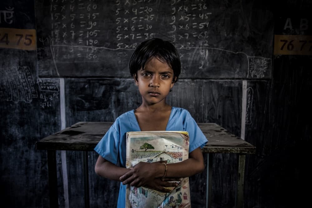 Indian Schoolgirl With Books by Fadhel Almutaghawi — canvas wall art