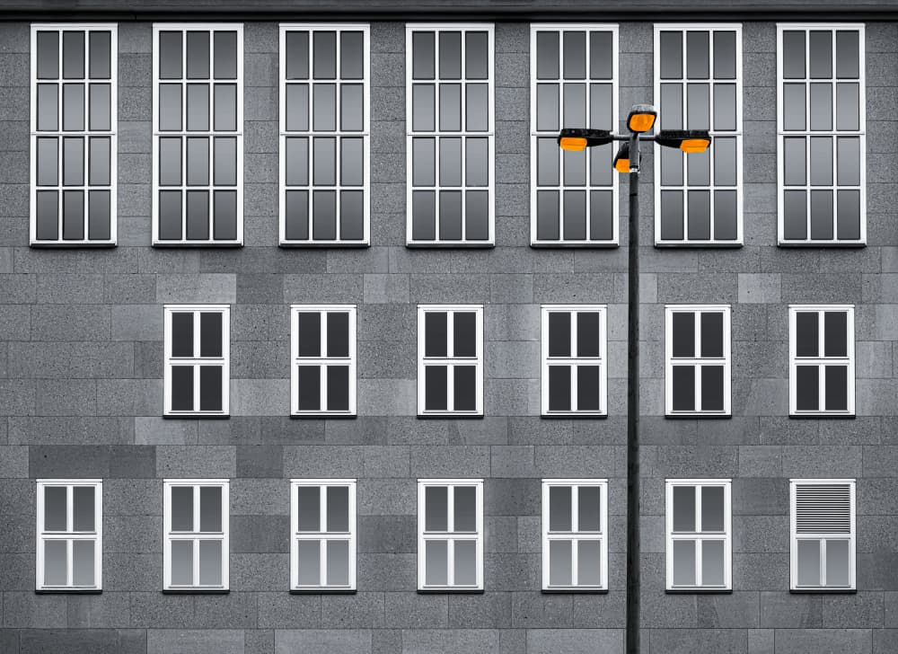 City Facade Orange Lights by Roland M Schwerdtfeger — canvas wall art