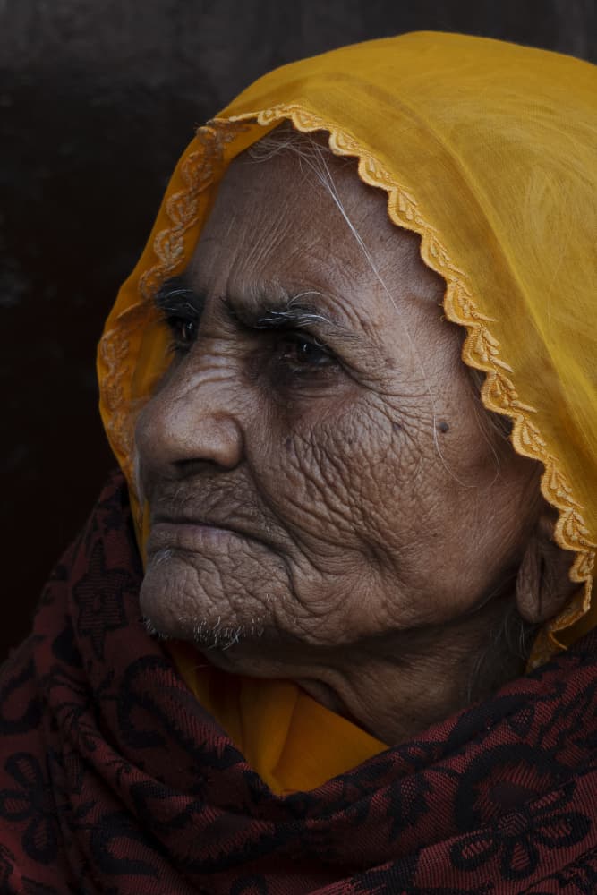 Pensive Elderly Woman by Elena Molina — canvas wall art