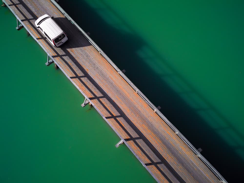 Car on Wooden Bridge by Primož Kožuh — canvas wall art