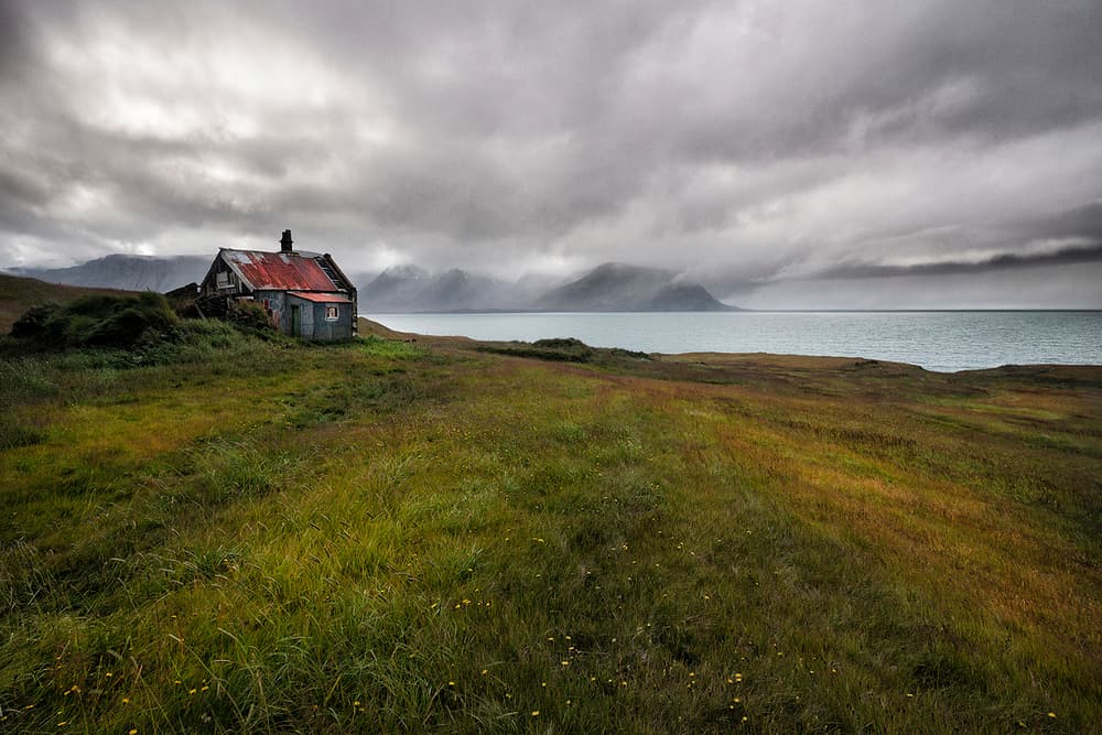 Weathered Coastal Cabin by Þorsteinn H. Ingibergsson — canvas wall art
