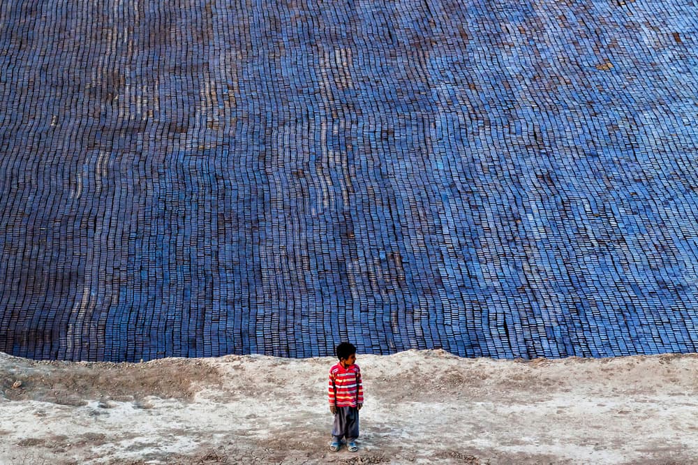 Boy And Blue Bricks by Mohammadreza Momeni — canvas wall art