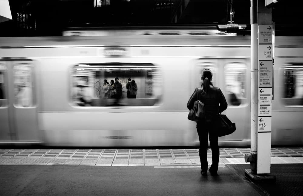 Solitary Woman Passing Train by Reiko kiri — canvas wall art