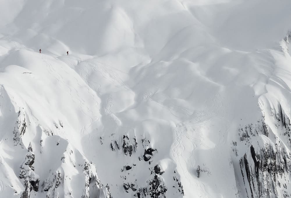 Snowy Peaks Skiers by Uschi Hermann — canvas wall art
