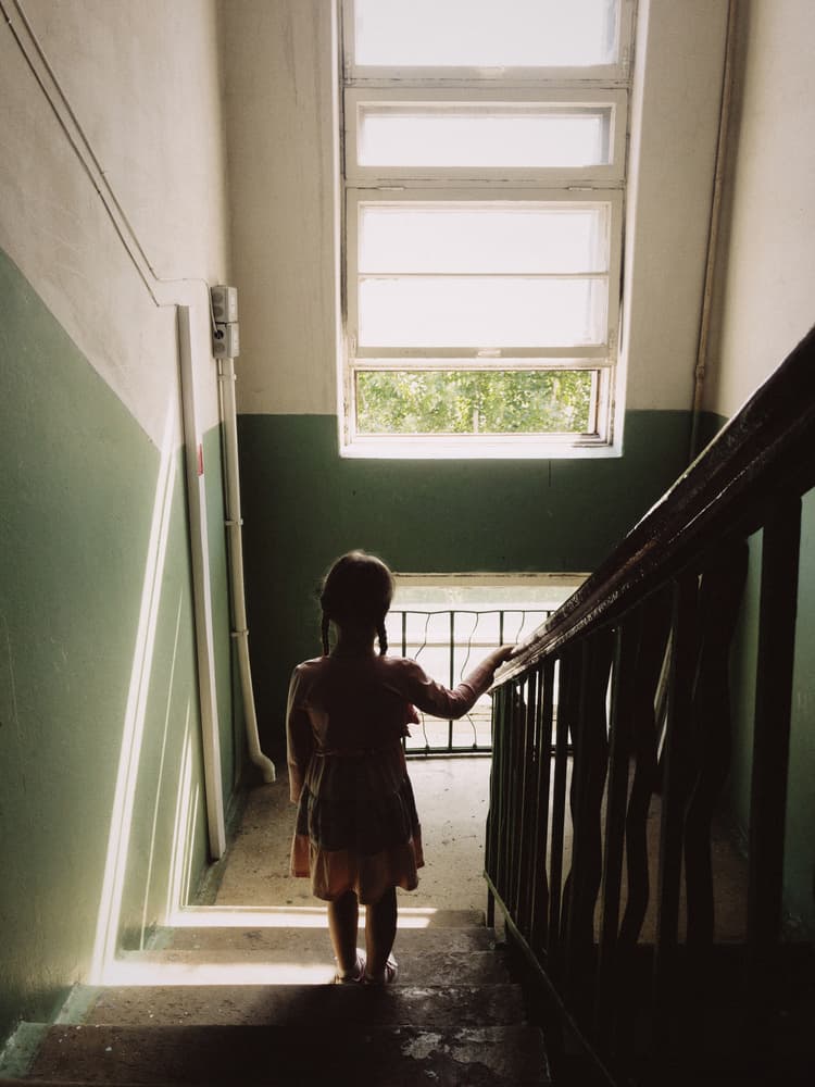 Girl in Sunlight Stairwell by Karina Aleksandrova — canvas wall art