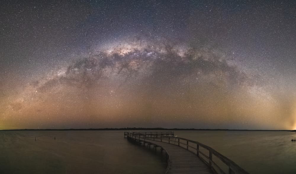 Starry Night Pier by HIRAK BHATTACHARJEE — canvas wall art