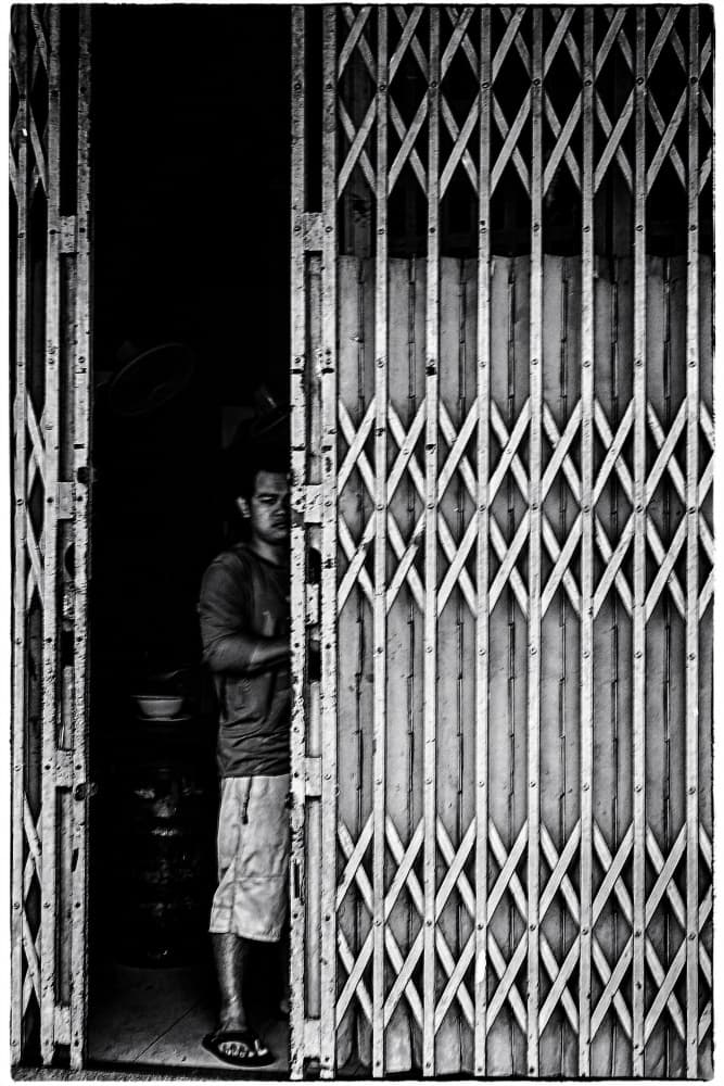 Pensive Man At Gate by Parole Kim — canvas wall art