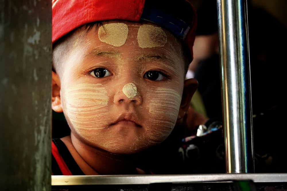 Burmese Boy with Thanaka by Elena Molina — canvas wall art