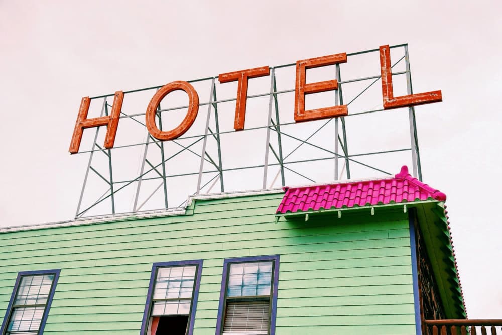 Colorful Hotel Sign by Del Mundo Imagery — canvas wall art