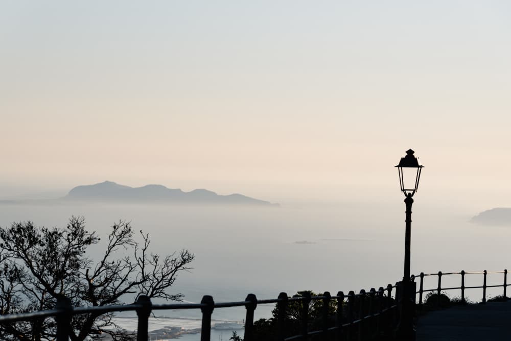 Lamppost Over Misty Sea by Photolovers — canvas wall art