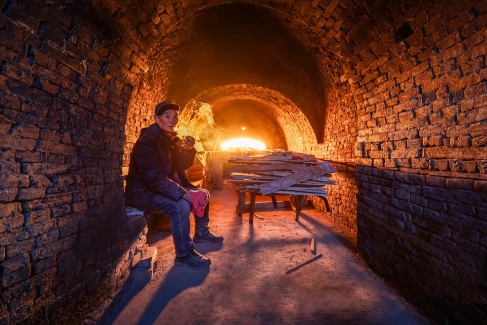 Man By The Kiln Fire by Irene Wu — canvas wall art