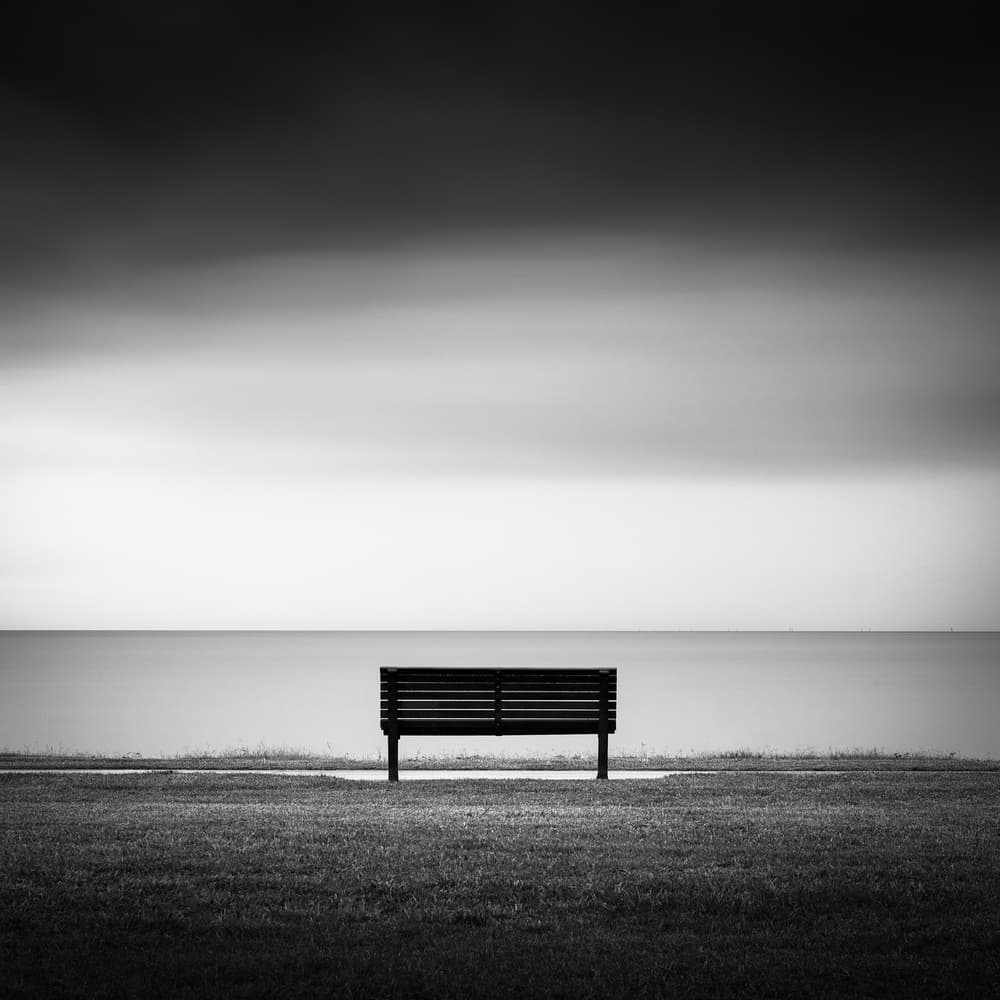 Solitary Bench Serene Sea by Jacqueline Hammer — canvas wall art