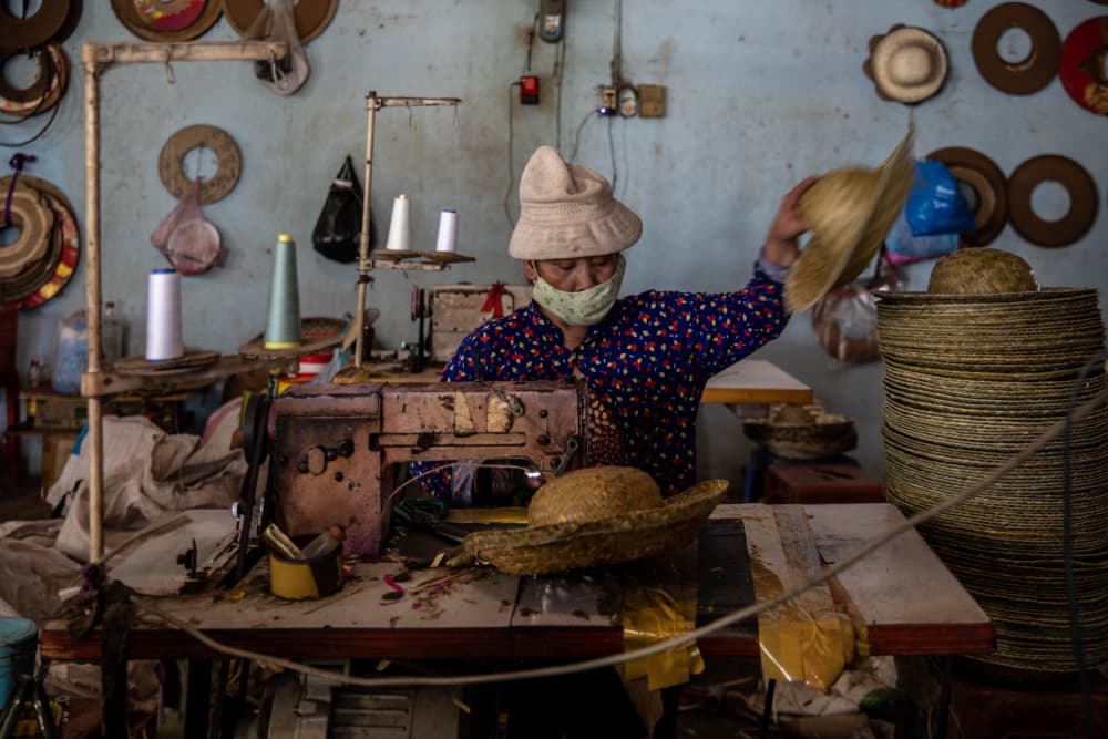 Hat Maker at Work by Ella Waldman — canvas wall art