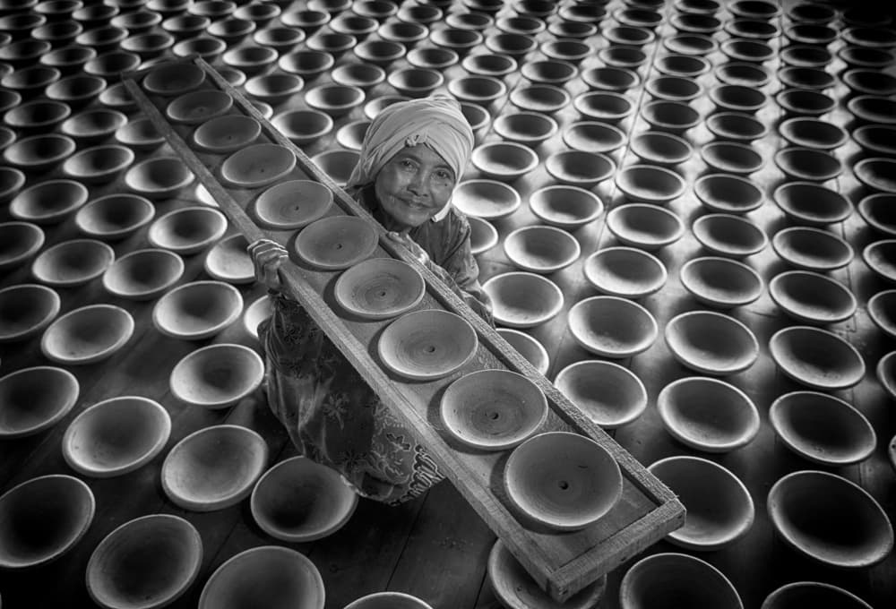Smiling Pottery Artisan by Angela Muliani Hartojo — canvas wall art