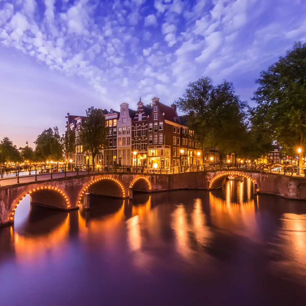 Illuminated Amsterdam Canals by Melanie Viola — canvas wall art
