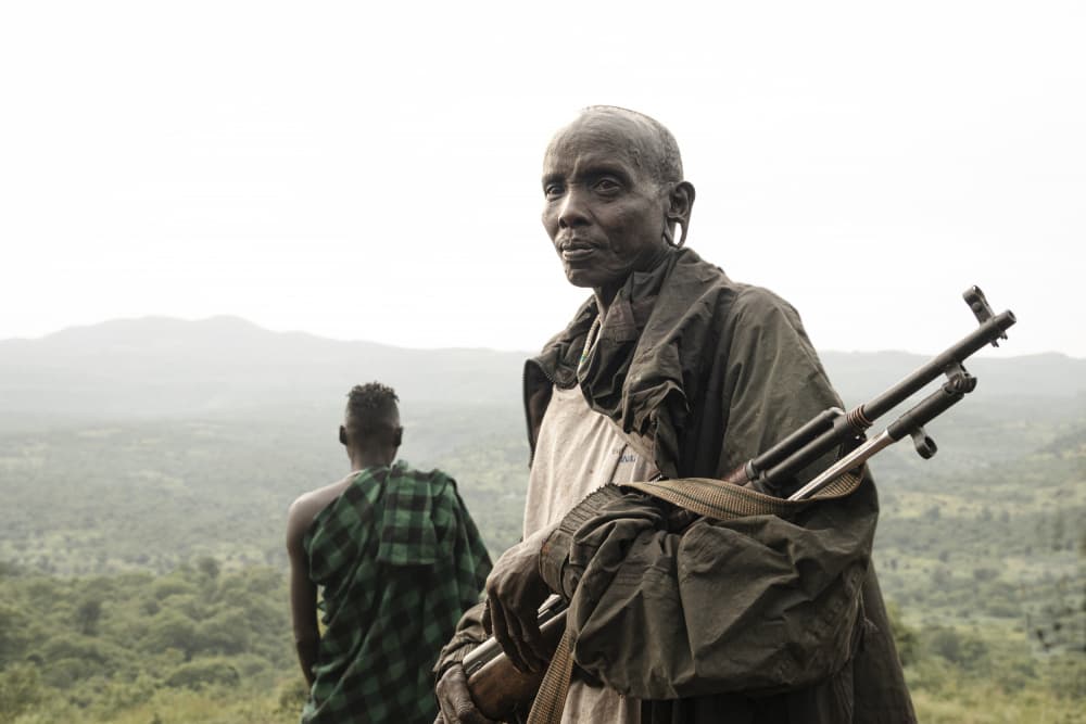 African Woman With Rifle by Elena Molina — canvas wall art