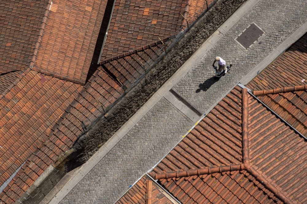 Rooftops and Cobblestone Path by Primož Kožuh — canvas wall art