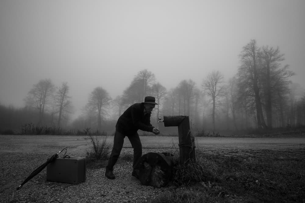 Solitary Traveler Foggy Road by Ummu Nisan Kandilcioglu — canvas wall art