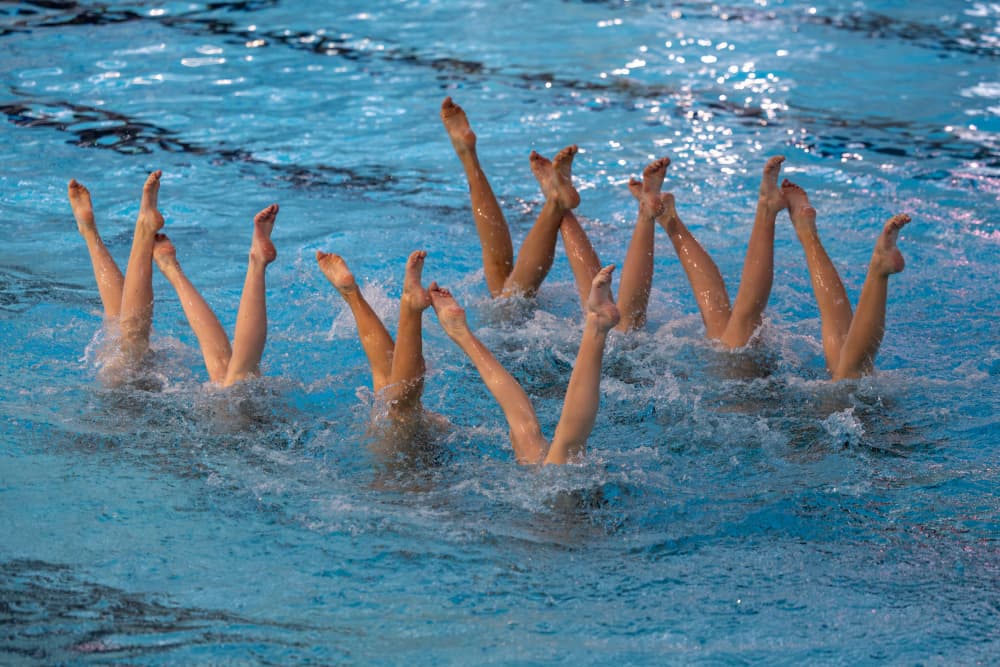 Synchronized Legs In Water by Azim Khan Ronnie — canvas wall art