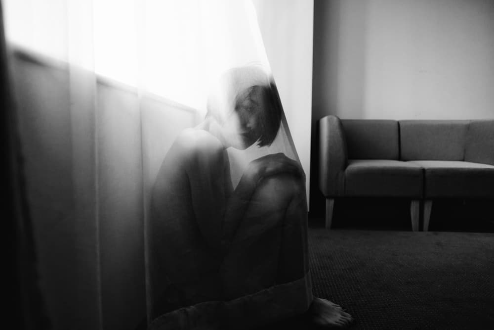 Pensive Woman Behind Sheer Curtain by Takaaki Ishikura — canvas wall art
