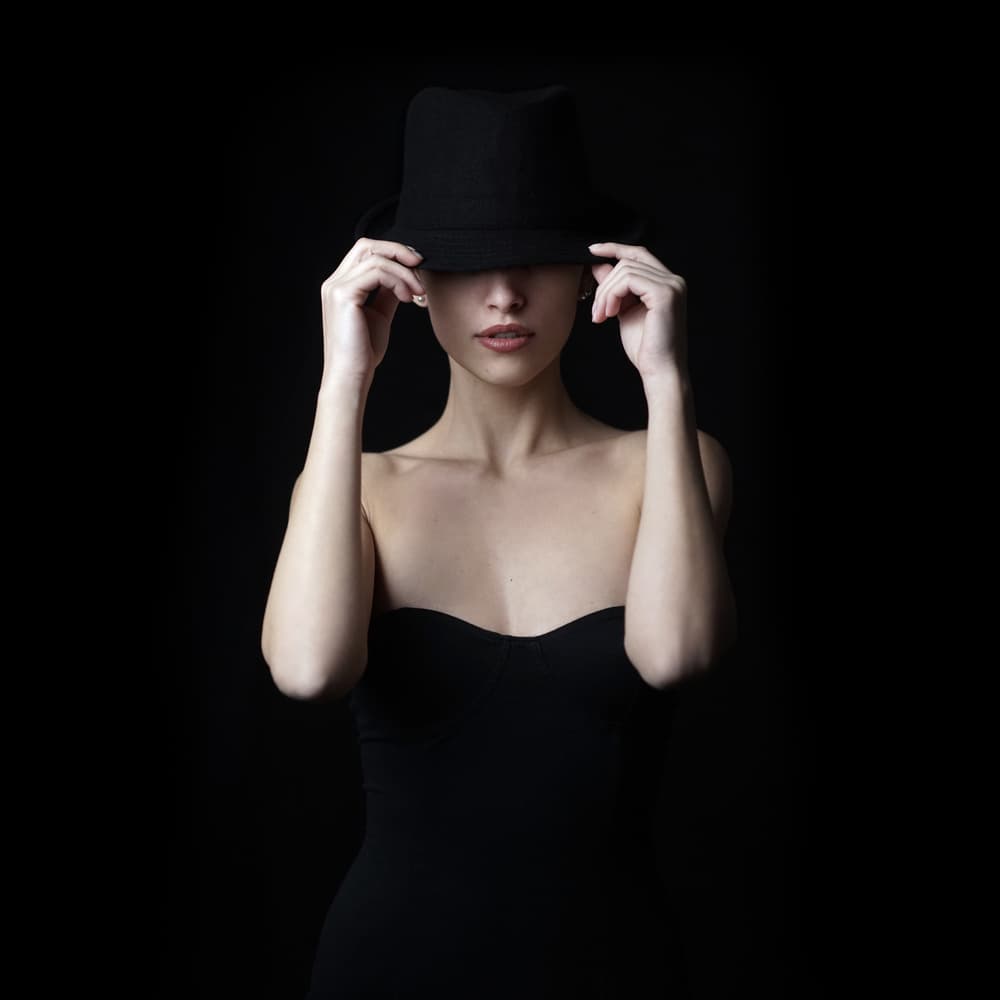Mysterious Woman In Hat by Bobby Kostadinov — canvas wall art