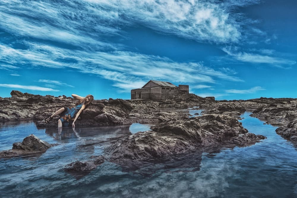 Woman on Rocky Shore by KOIKI — canvas wall art
