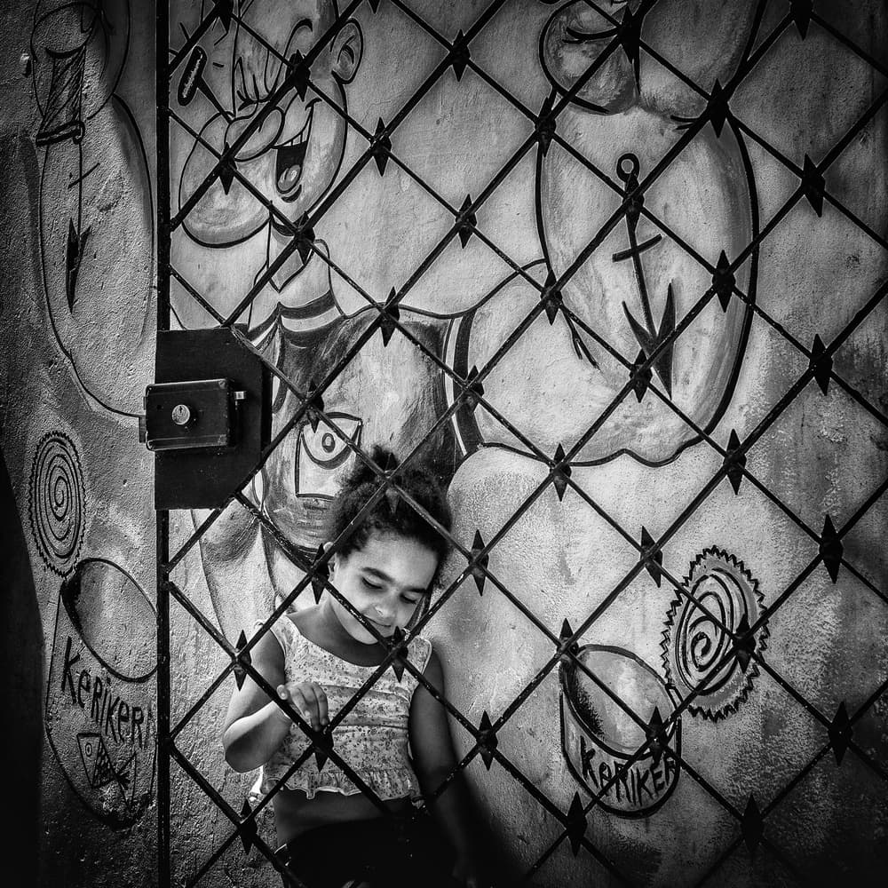 Child Behind Urban Gate by Pavol Stranak — canvas wall art