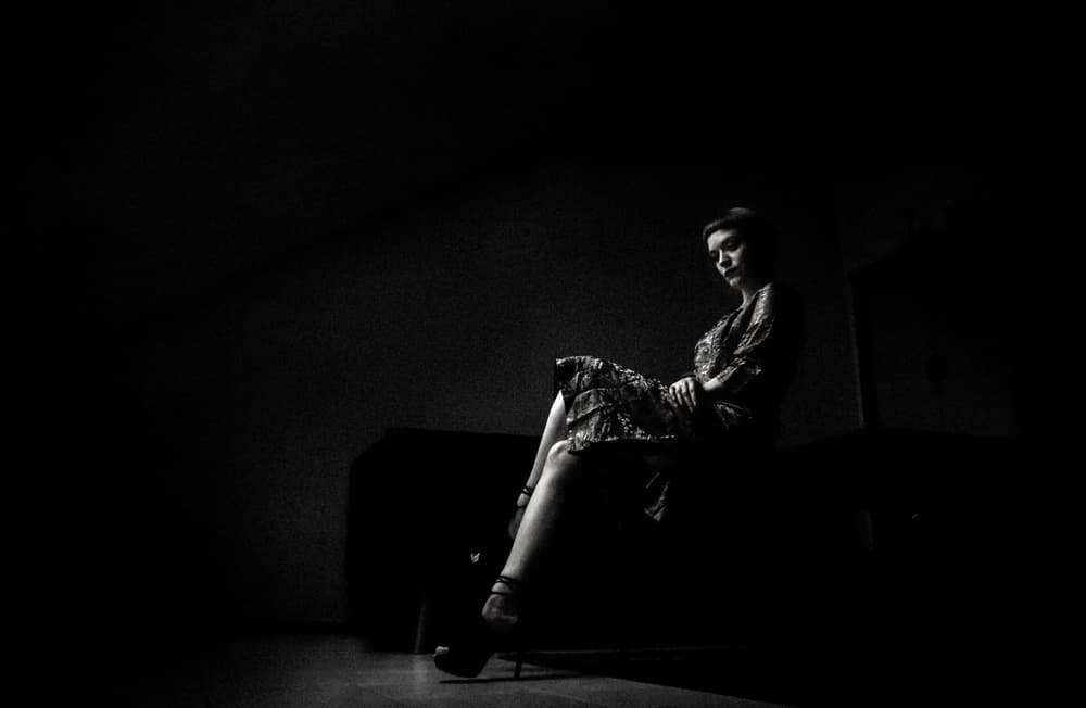 Pensive Woman in Shadow by Erkan Camlilar — canvas wall art