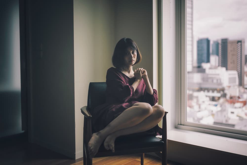 Thoughtful Woman City View by Nobu Ishijima — canvas wall art