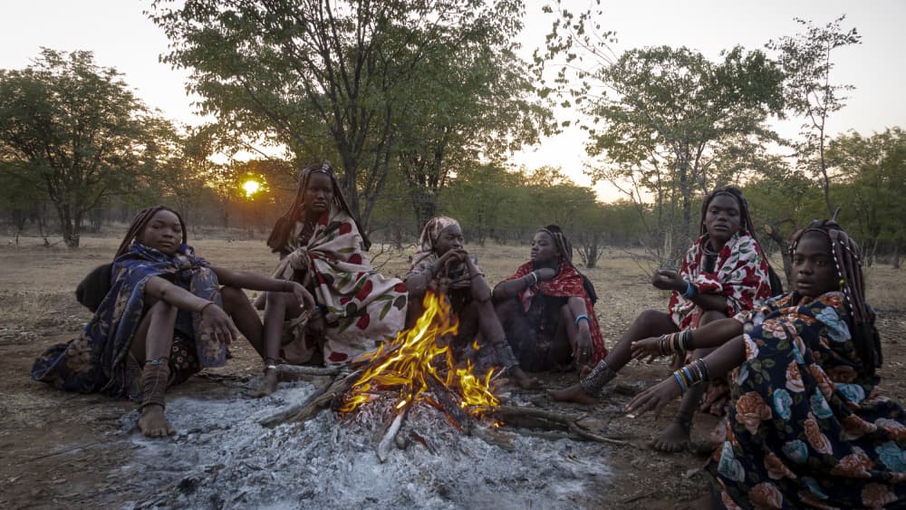 African Women Campfire Sunset by Elena Molina — canvas wall art