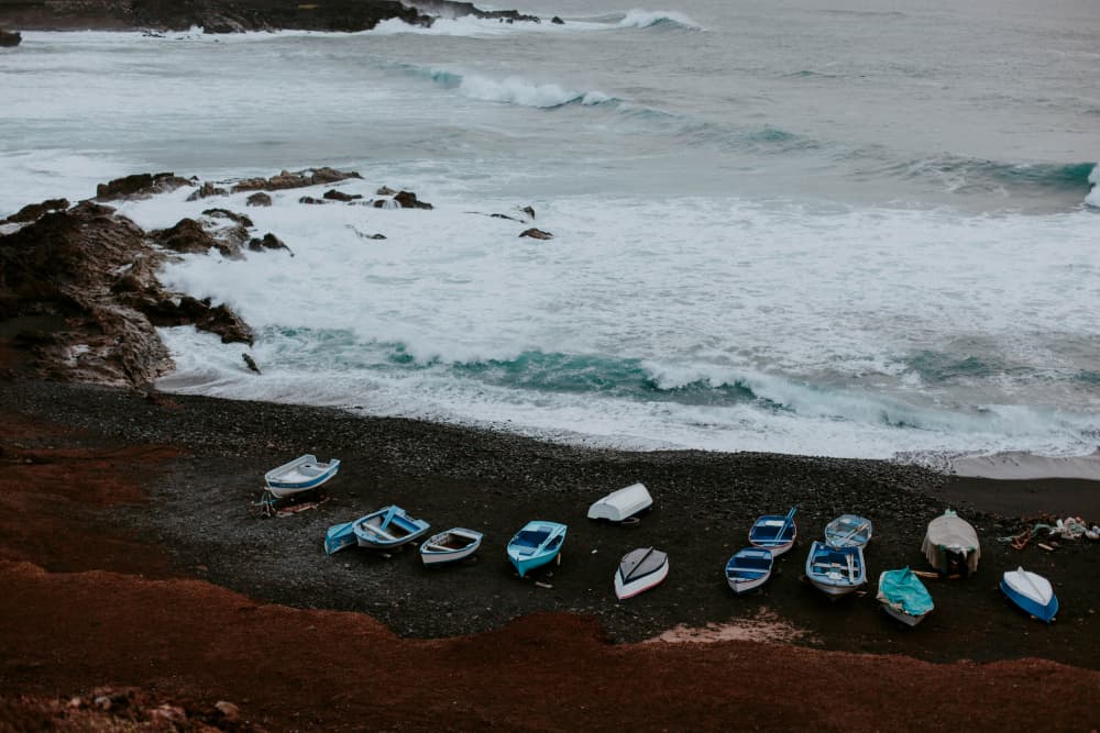 Boats on Dark Shore by Claudia Casal — canvas wall art