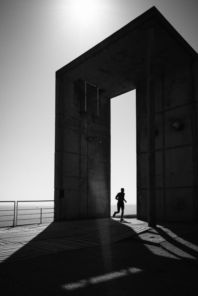 Running Man Through Arch by Christophe Staelens — canvas wall art