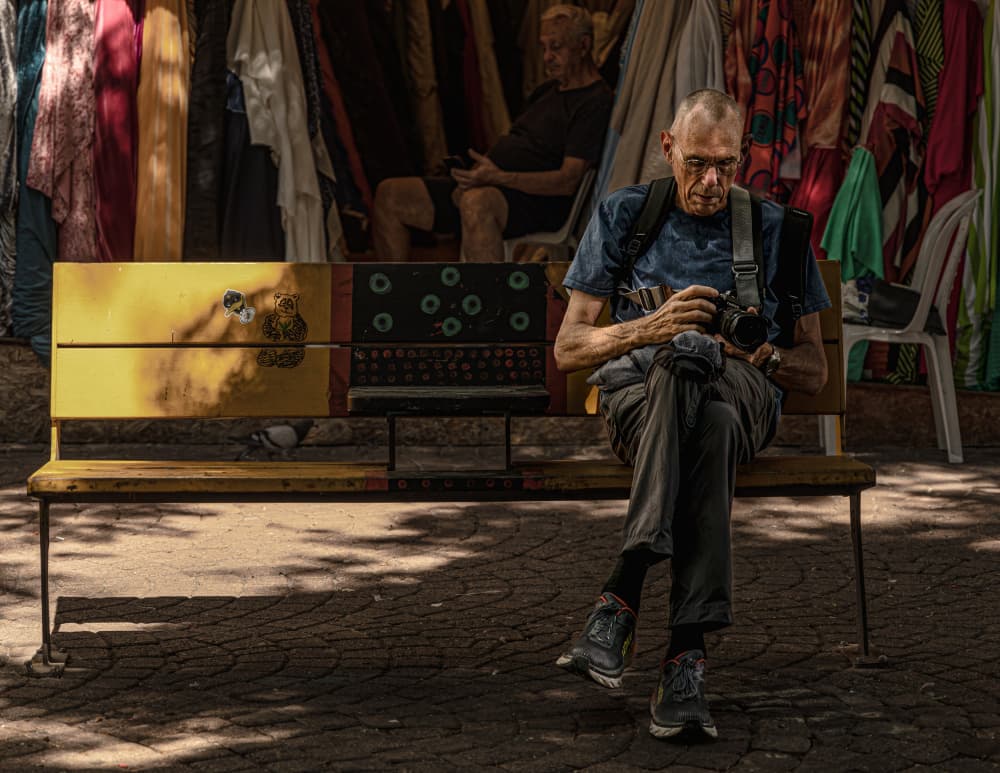 Contemplative Street Photographer by Gila Koller — canvas wall art