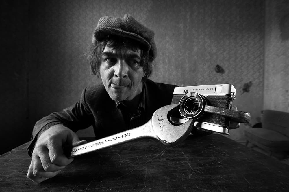 Man and Camera Wrench by mario grobenski - psychodaddy — canvas wall art