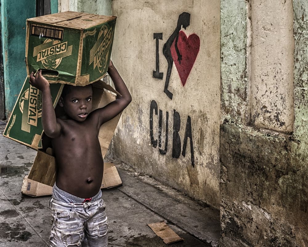 Cuban Child Carrying Boxes by Pavol Stranak — canvas wall art