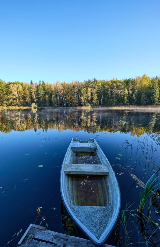 Autumn Lake Rowboat by Geertjan Plooijer — canvas wall art