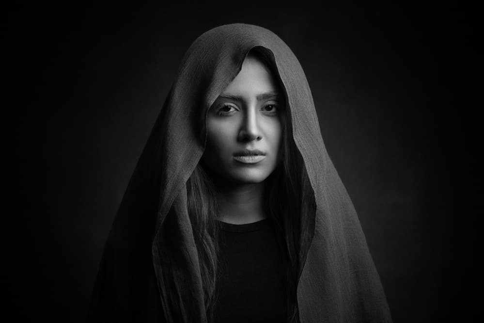 Pensive Hooded Woman by Mehdi Mokhtari — canvas wall art