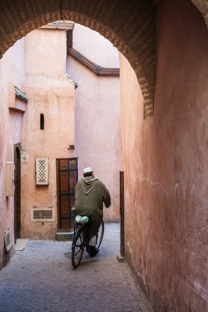 Alleyway Rider in Pink City by Photolovers — canvas wall art