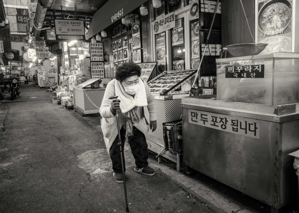 Elderly Woman Korean Market by Rudy Mareel — canvas wall art