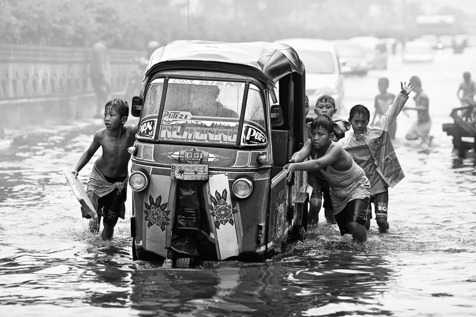 Children Push Flooded Bajaj by Hari Sulistiawan — canvas wall art