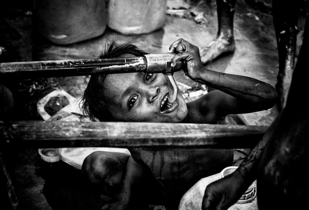 Boy Drinking Water Smile by Joxe Inazio Kuesta Garmendia — canvas wall art