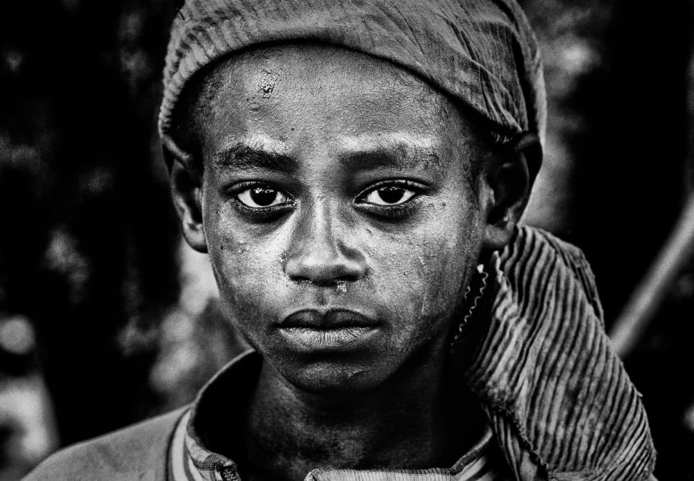 Solemn Child Portrait by Joxe Inazio Kuesta Garmendia — canvas wall art