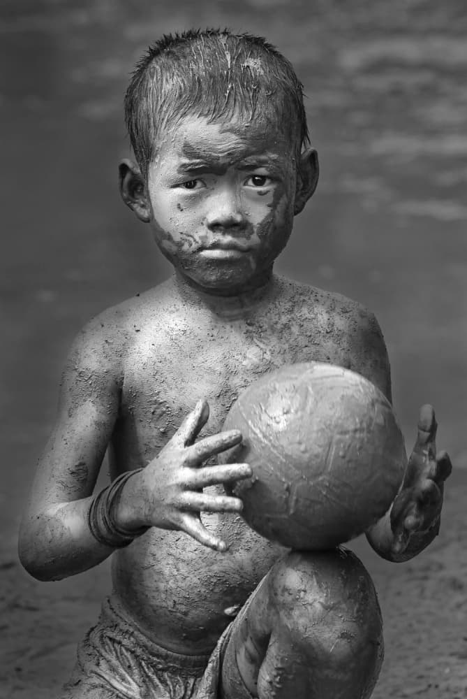 Muddy Boy with Ball by Angela Muliani Hartojo — canvas wall art
