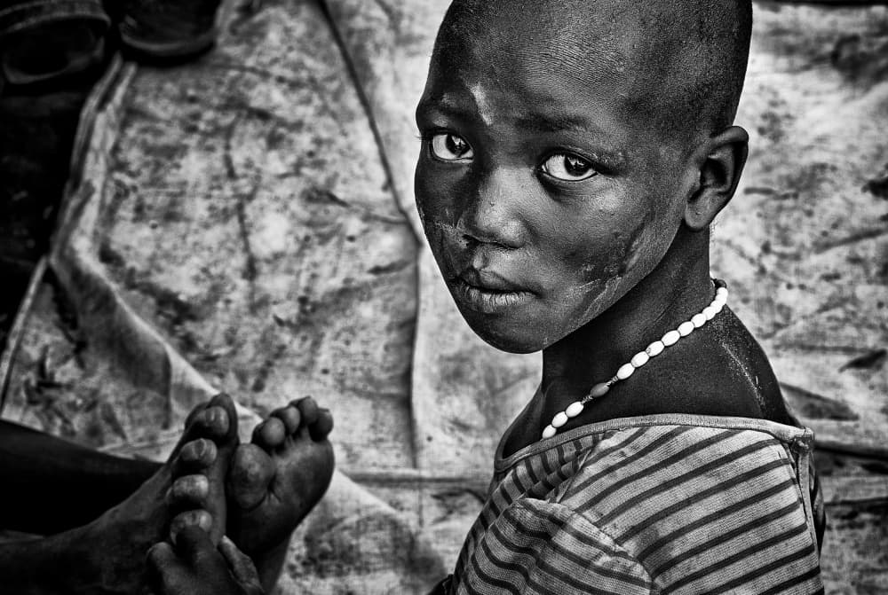 Boy With Serious Eyes by Joxe Inazio Kuesta Garmendia — canvas wall art