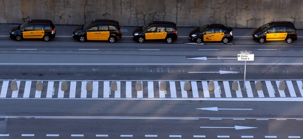Yellow Taxis Lined Up by Hans-Wolfgang Hawerkamp — canvas wall art