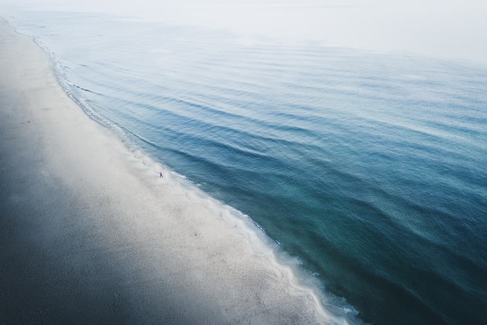 Serene Shoreline Aerial by Witold Ziomek — canvas wall art