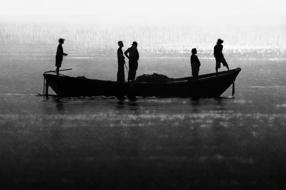 Misty Boat Silhouettes by Ekkachai Khemkum — canvas wall art